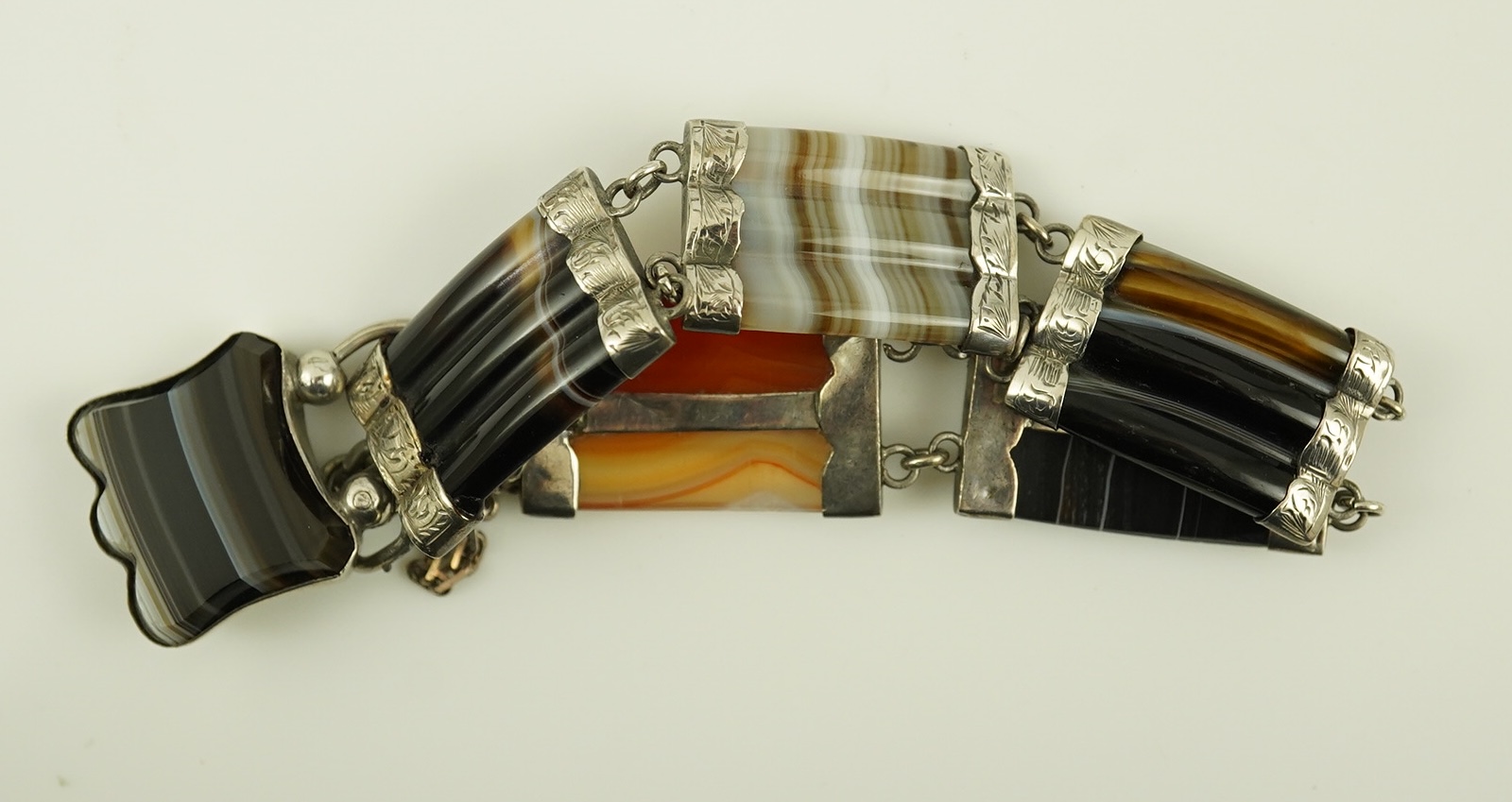 Two late 19th century Scottish silver and agate set bracelets